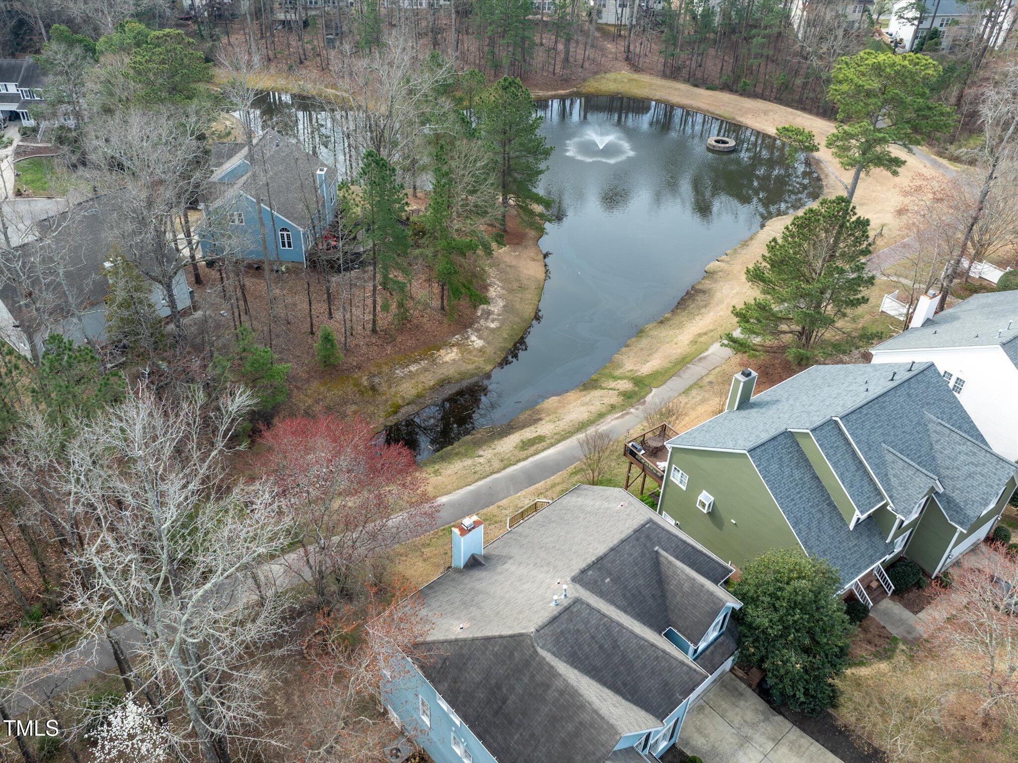 104 Deep Gap Run Cary, NC 27519 - Photo 28 of 39 an aerial view of a house with a yard and a large tree