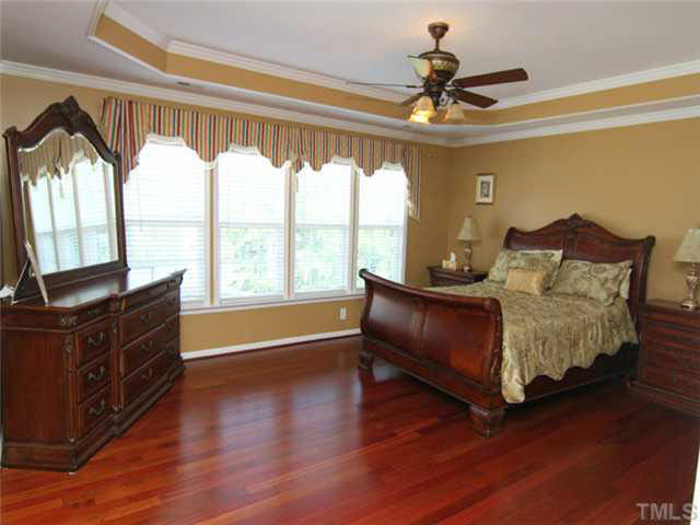7601 Vista Del Rey Lane Raleigh, NC 27613 - Photo 13 of 24 Master Suite also boasts Brazilian cherry hardwood floors, trey ceiling, and beautiful trim work. Spacious, accommodating room. Master Bedroom