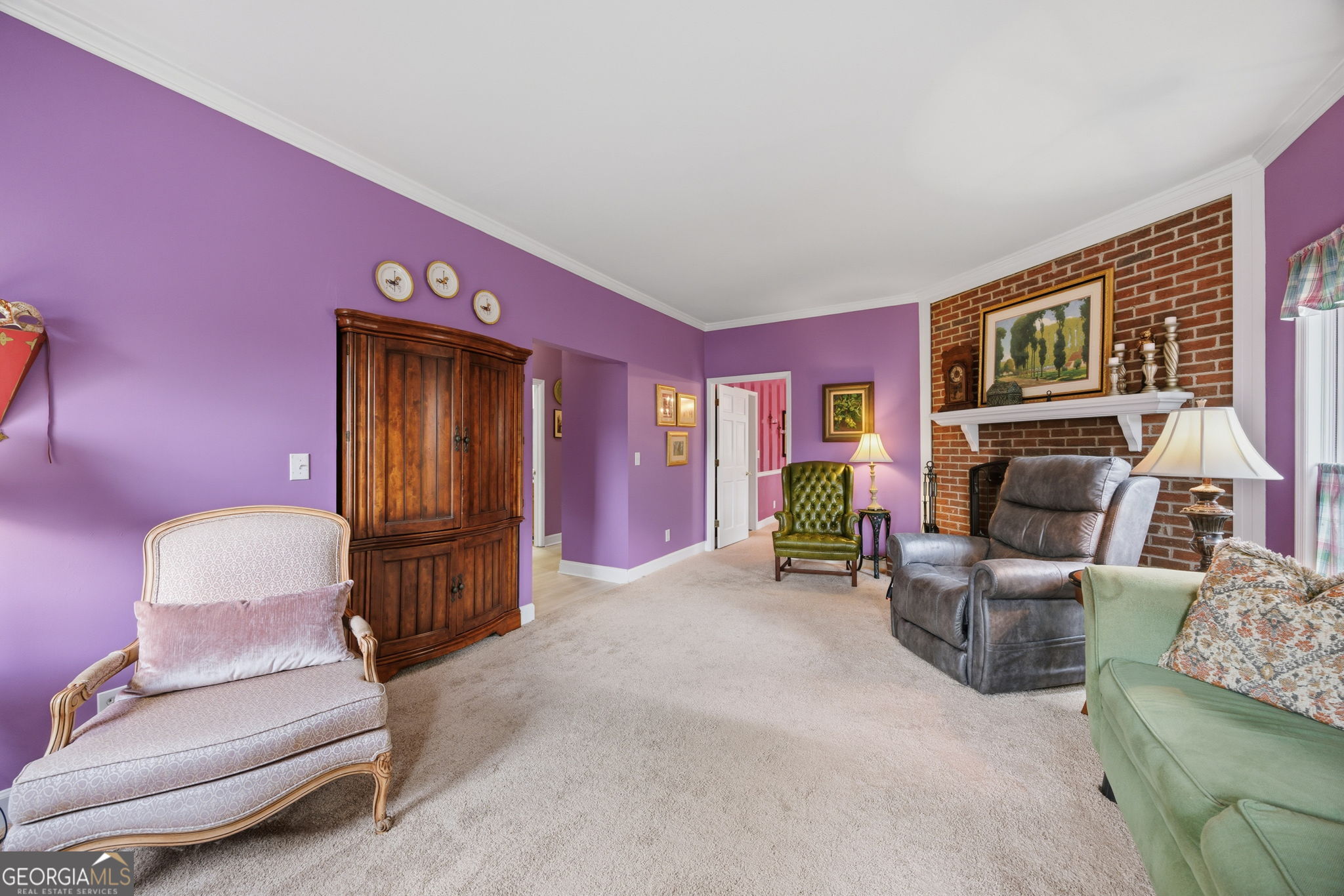 1391 Briarcliff Road, Unit 4B Macon, GA 31211 - Photo 22 of 42 a living room with furniture and a fireplace