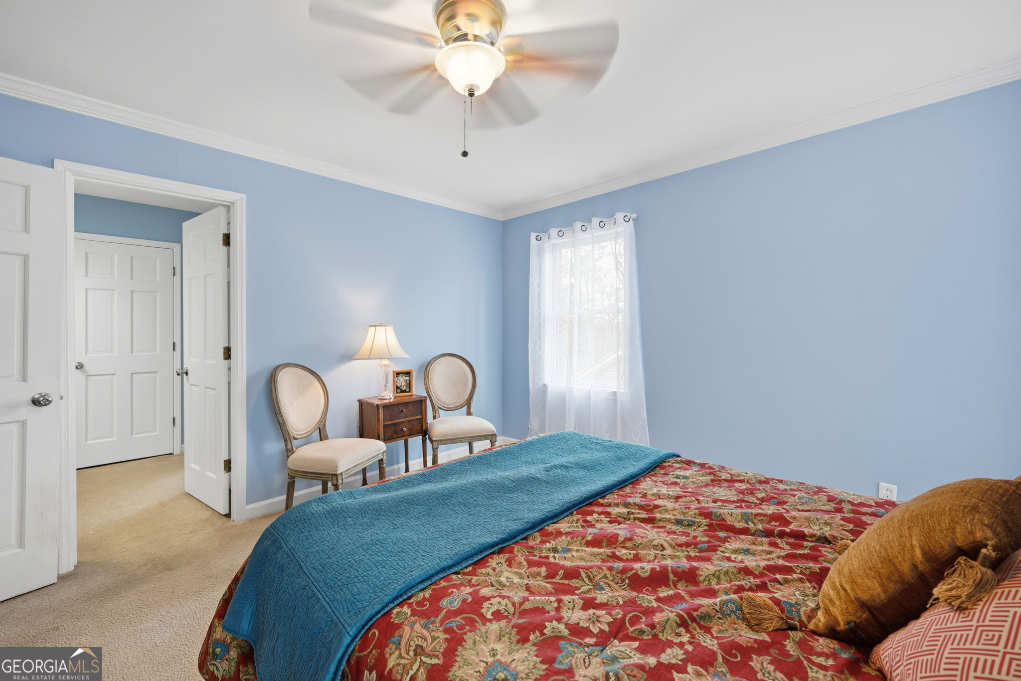 1391 Briarcliff Road, Unit 4B Macon, GA 31211 - Photo 25 of 42 a bedroom with bed and a chandelier