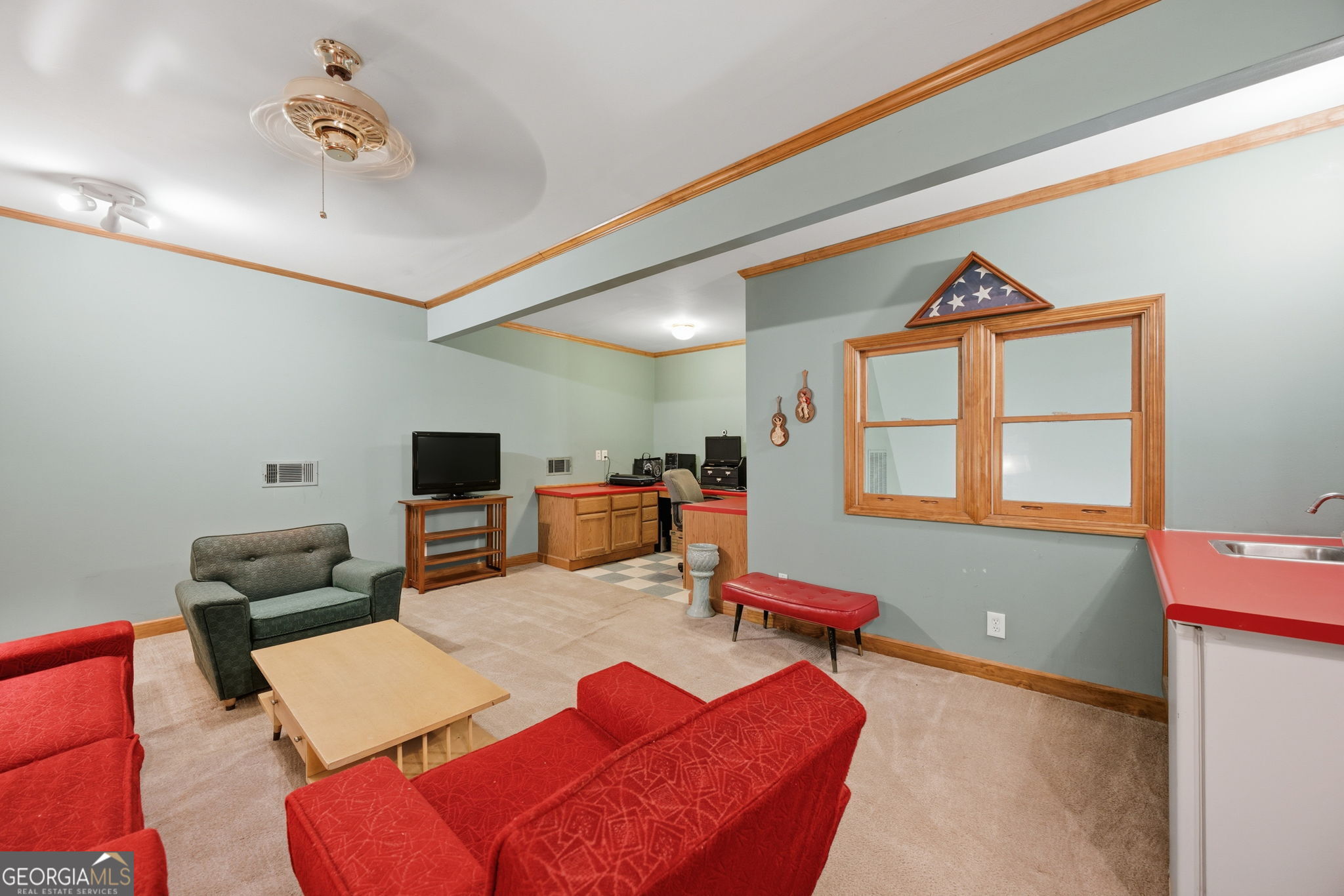 1391 Briarcliff Road, Unit 4B Macon, GA 31211 - Photo 33 of 42 a living room with furniture and a flat screen tv