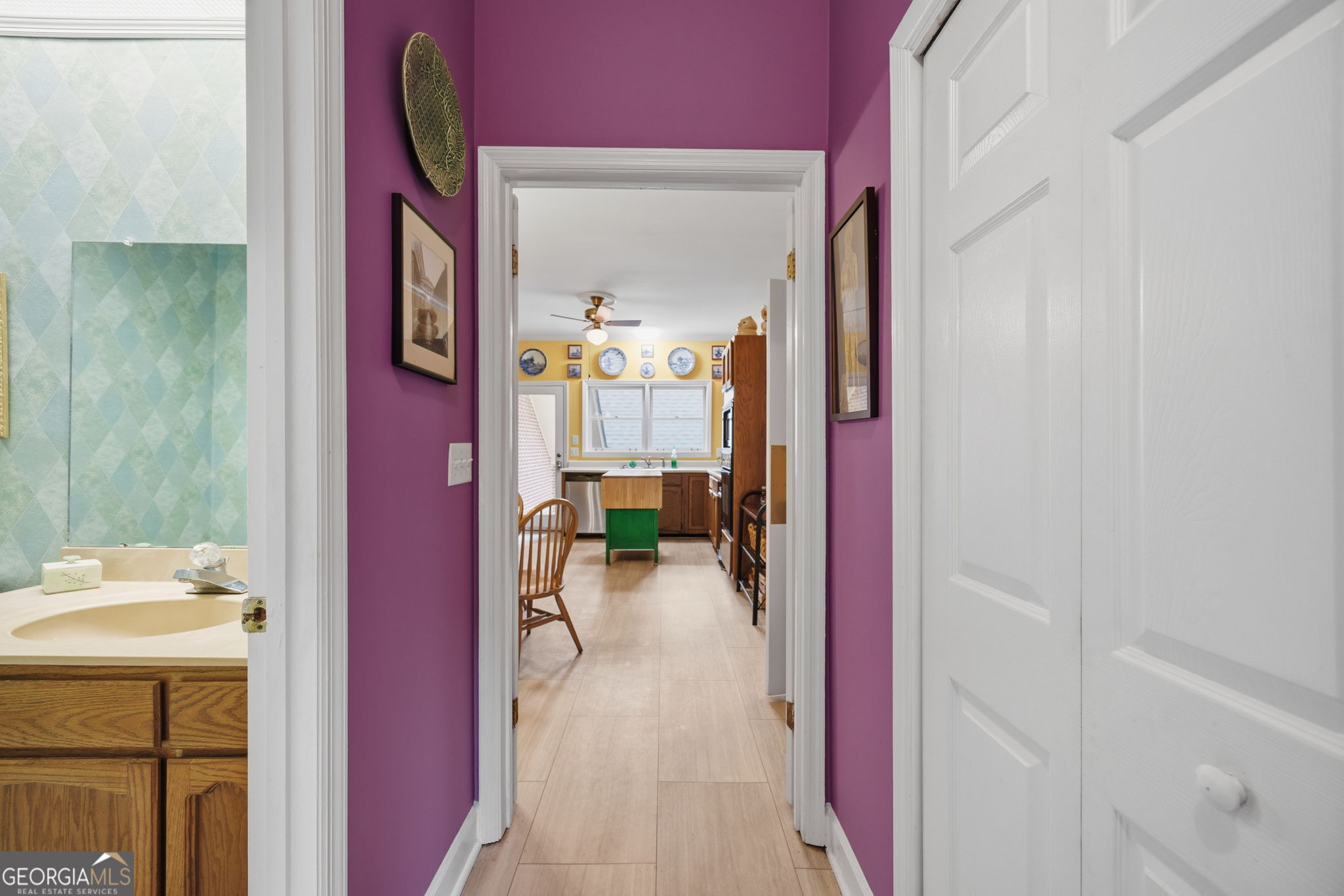 1391 Briarcliff Road, Unit 4B Macon, GA 31211 - Photo 6 of 42 a view of a hallway to a livingroom and a dinning area with furniture