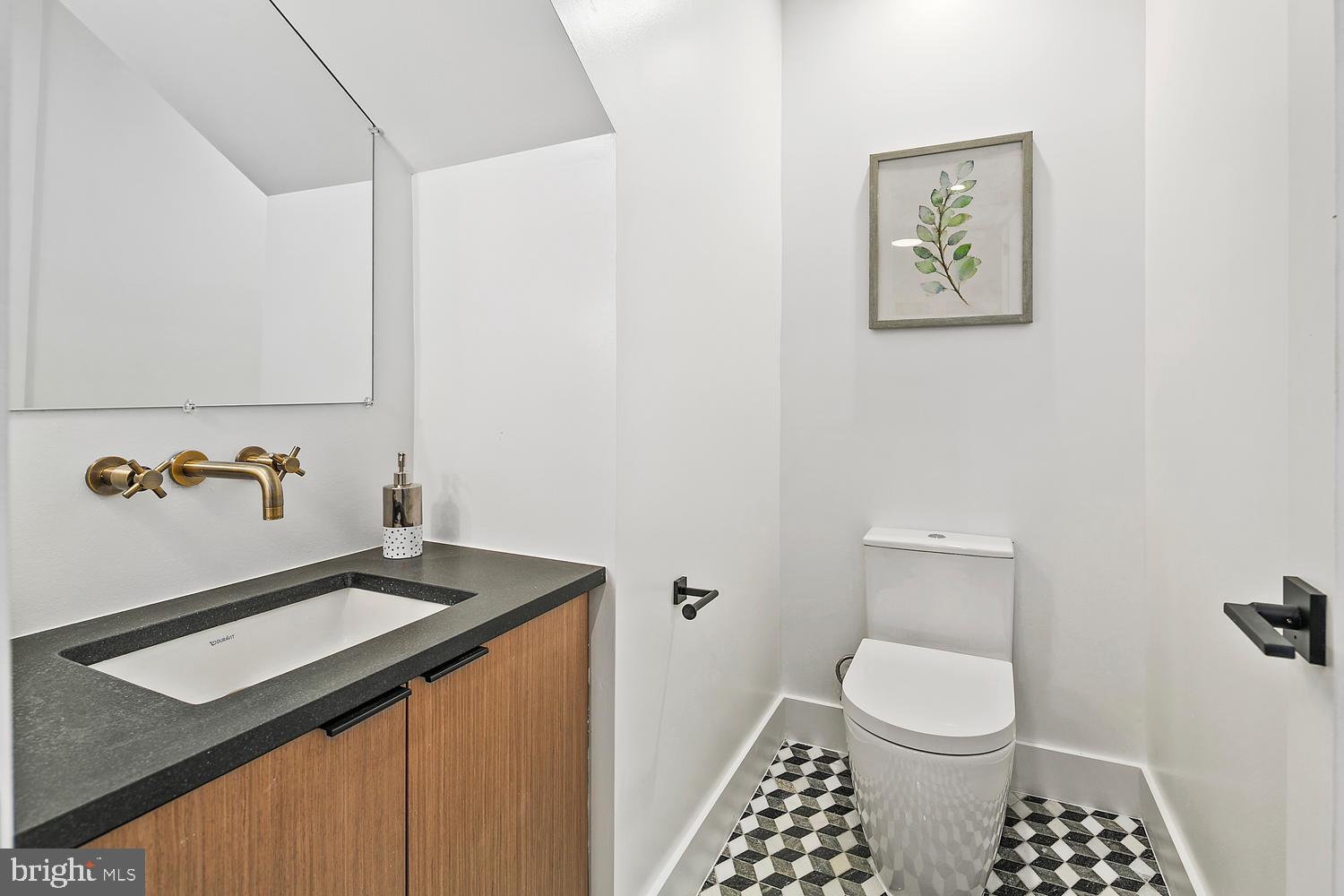 1316 8th Street Northwest, Unit 1 Washington, DC 20001 - Photo 15 of 25 Half bath with marble floor and wall mount faucet