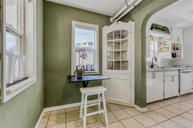 a living room with furniture a rug and a fireplace