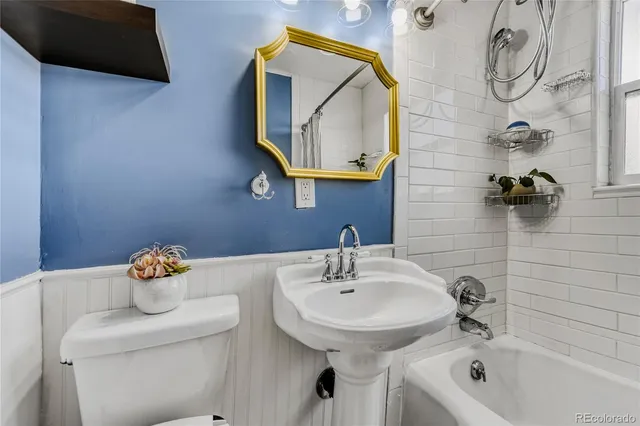 a building outdoor space with patio furniture and potted plants