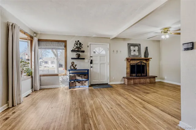 a view of a livingroom with furniture and a fireplace