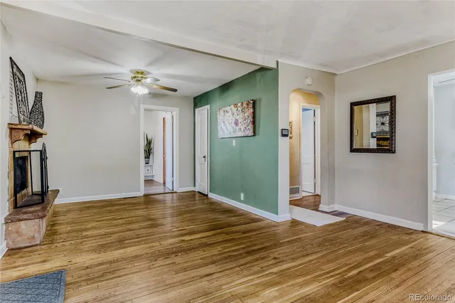 a view of livingroom with hardwood floor and ceiling fan