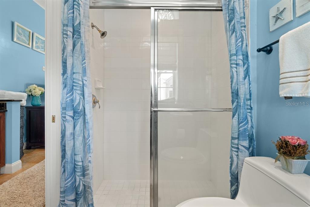 4606 Oak Hammock Court, Unit 4606 Ponce Inlet, FL 32127 - Photo 11 of 92 a bathroom with a shower