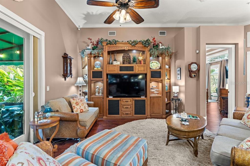 4606 Oak Hammock Court, Unit 4606 Ponce Inlet, FL 32127 - Photo 20 of 92 a living room with furniture and a fireplace