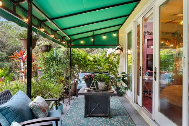 a bathroom with a granite countertop sink a toilet and a mirror