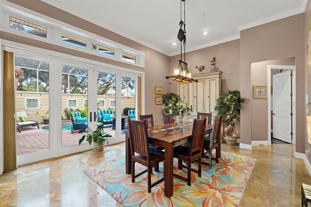 4606 Oak Hammock Court, Unit 4606 Ponce Inlet, FL 32127 - Photo 29 of 92 a view of a dining room with furniture window and wooden floor