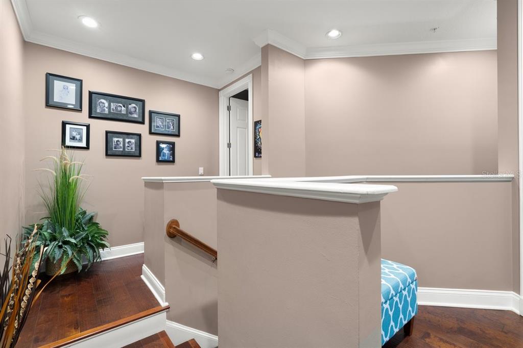 4606 Oak Hammock Court, Unit 4606 Ponce Inlet, FL 32127 - Photo 40 of 92 a view of hallway with chair and potted plant