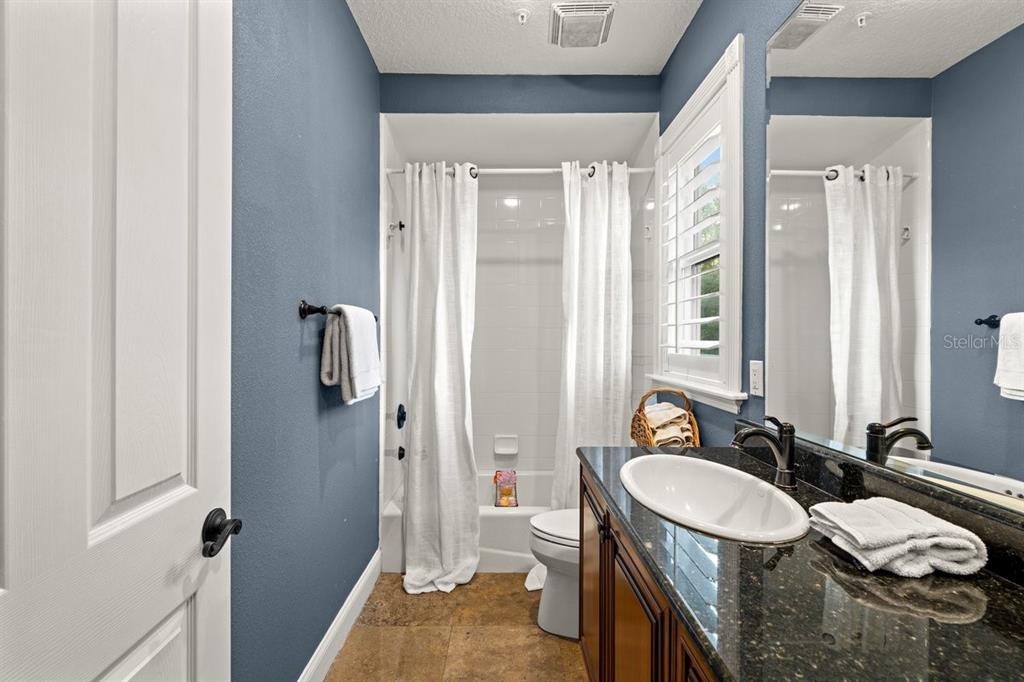 4606 Oak Hammock Court, Unit 4606 Ponce Inlet, FL 32127 - Photo 45 of 92 a bathroom with a sink double vanity granite tub and shower
