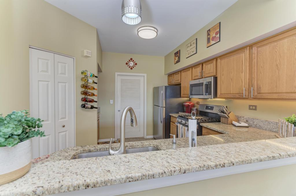 8321 Ripple Ridge Darien, IL 60561 - Photo 11 of 27 a view of a kitchen with granite countertop a sink and cabinets
