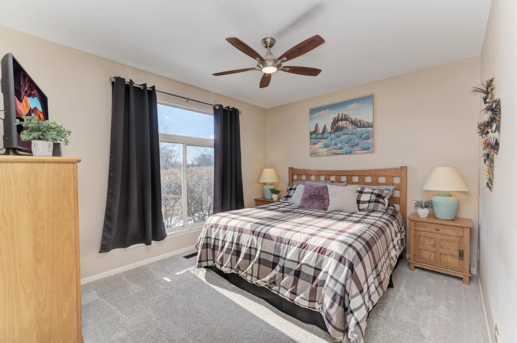 8321 Ripple Ridge Darien, IL 60561 - Photo 17 of 27 a bedroom with a bed and a large mirror