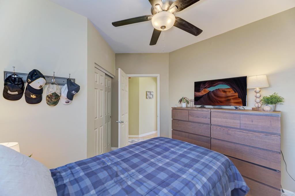 8321 Ripple Ridge Darien, IL 60561 - Photo 22 of 27 a bedroom with a bed and a dresser