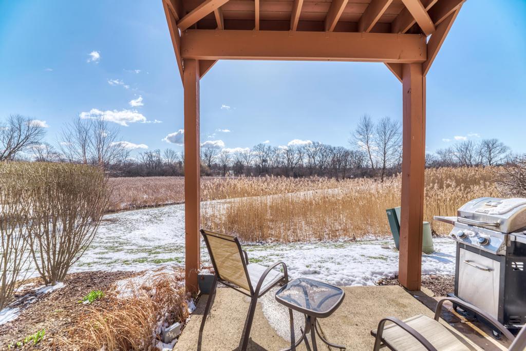 8321 Ripple Ridge Darien, IL 60561 - Photo 24 of 27 a view of a balcony with chair and table