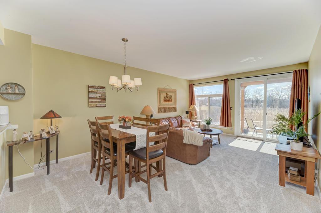 8321 Ripple Ridge Darien, IL 60561 - Photo 5 of 27 a living room with furniture and a large window