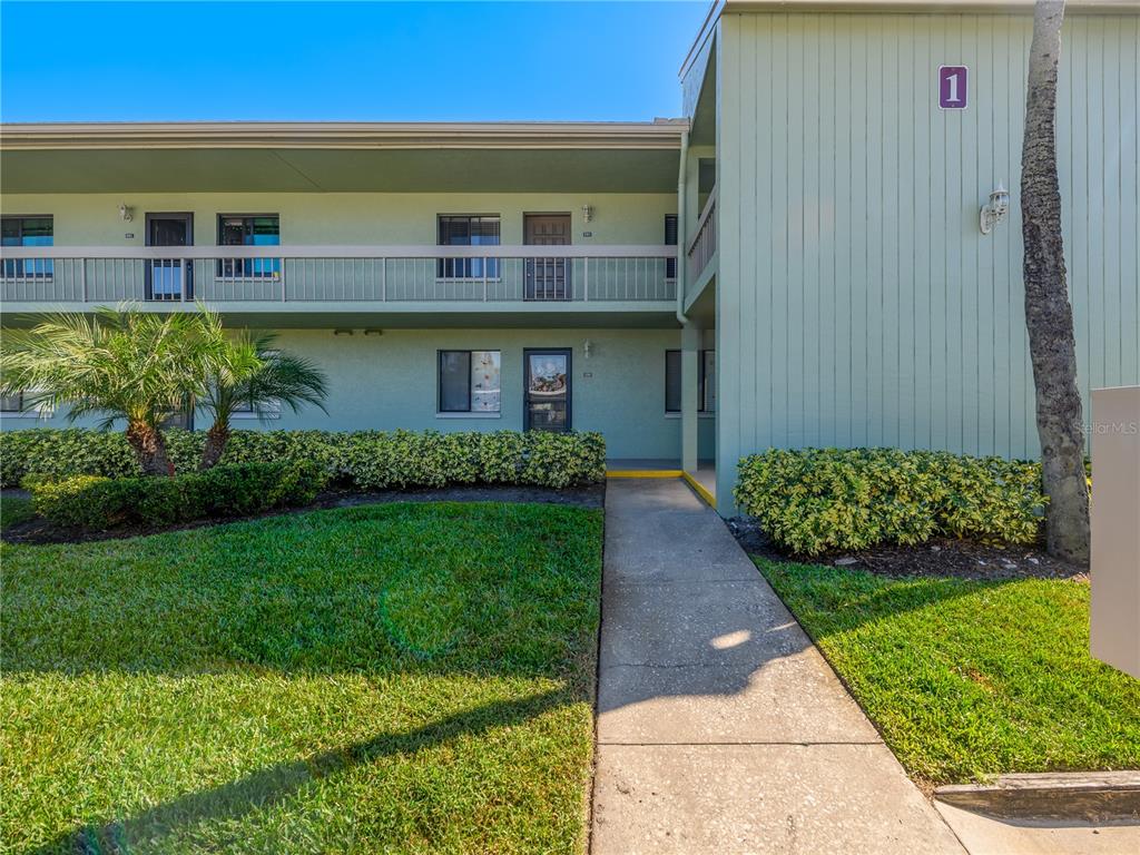 120 Caryl Way Oldsmar, FL 34677 - Photo 1 of 25 a front view of a house with a garden