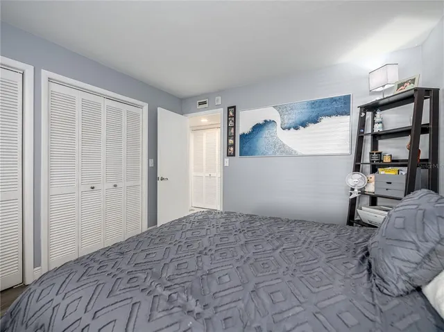 a bedroom with a bed and furniture