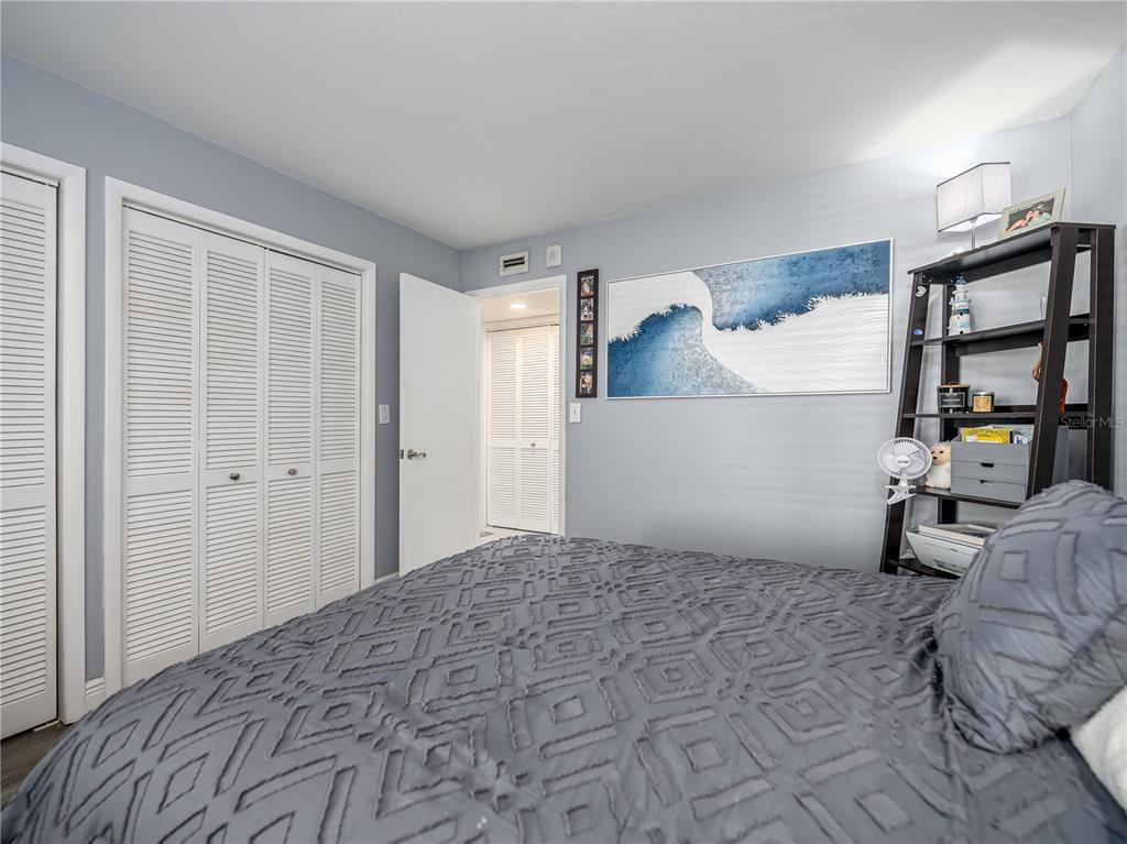 120 Caryl Way Oldsmar, FL 34677 - Photo 14 of 25 a bedroom with a bed and furniture