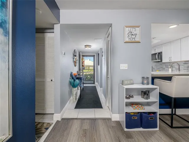 a view of living room with furniture and wooden floor