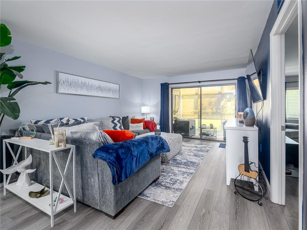 120 Caryl Way Oldsmar, FL 34677 - Photo 7 of 25 a bedroom with furniture and a large window