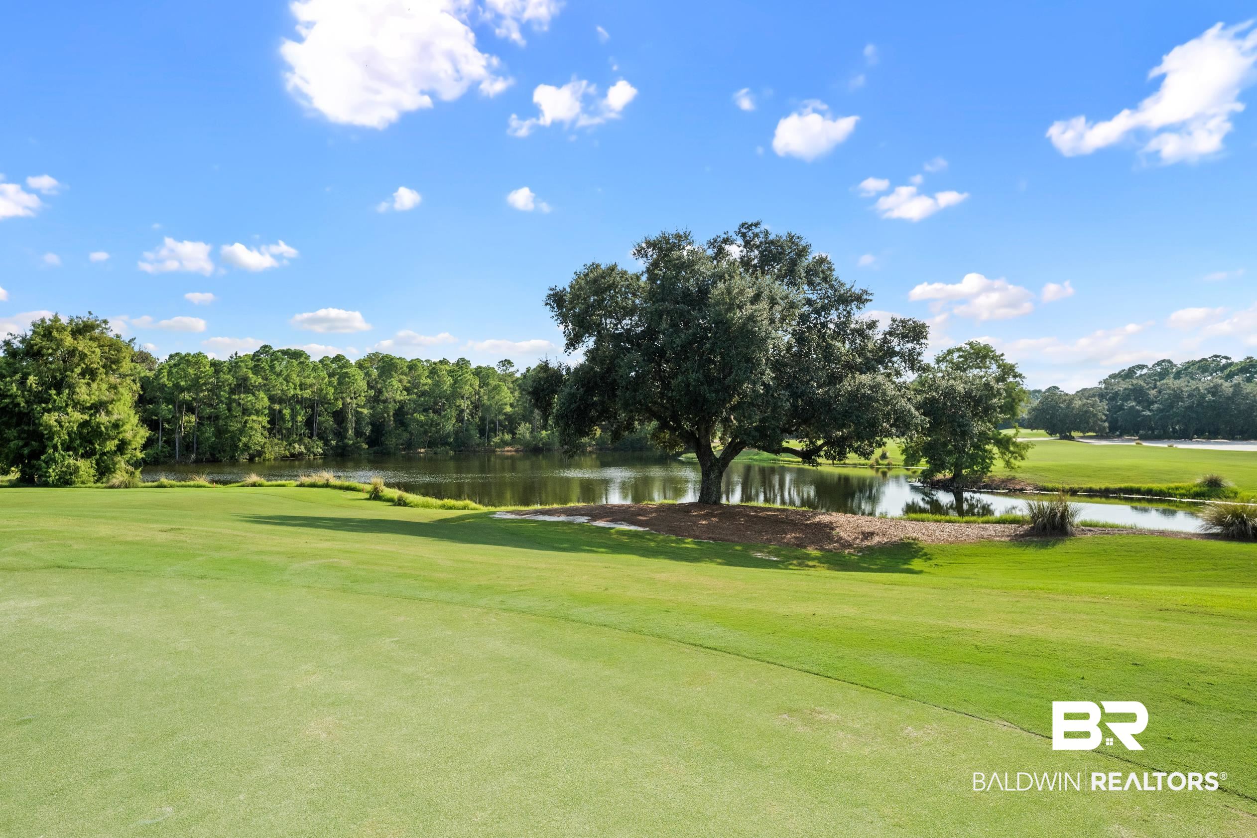 404 Peninsula Boulevard Gulf Shores, AL 36542 - Photo 50 of 51 View of home's community featuring a water view, golf course view, and a lawn