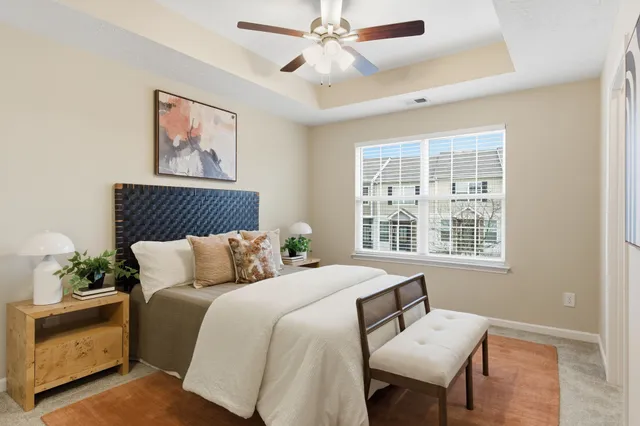 a bedroom with bed and a window