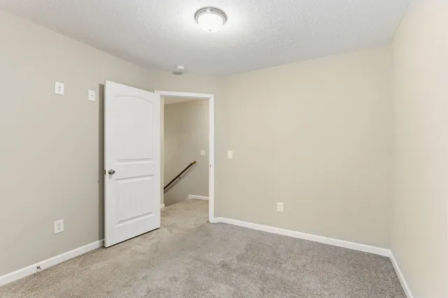 an empty room with a hallway