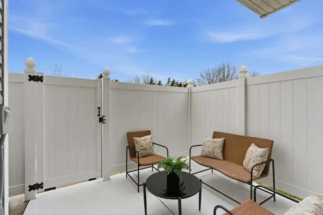a view of a chairs and table in a terrace