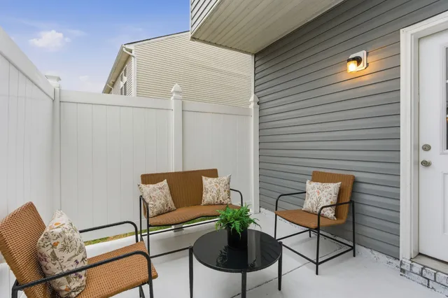 a outdoor view with a couch and a potted plant