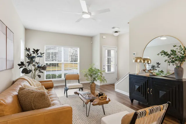 a living room with furniture and a large window