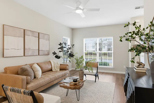 a living room with furniture and a large window