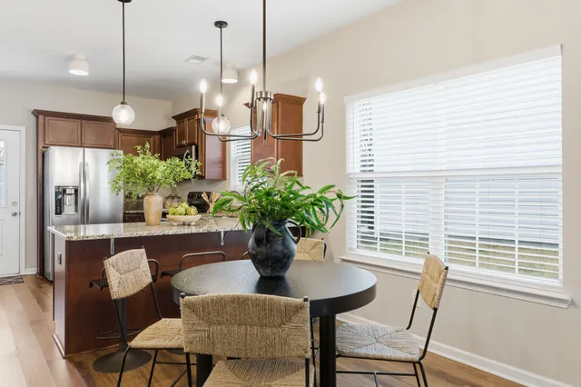 a dining room with furniture and window