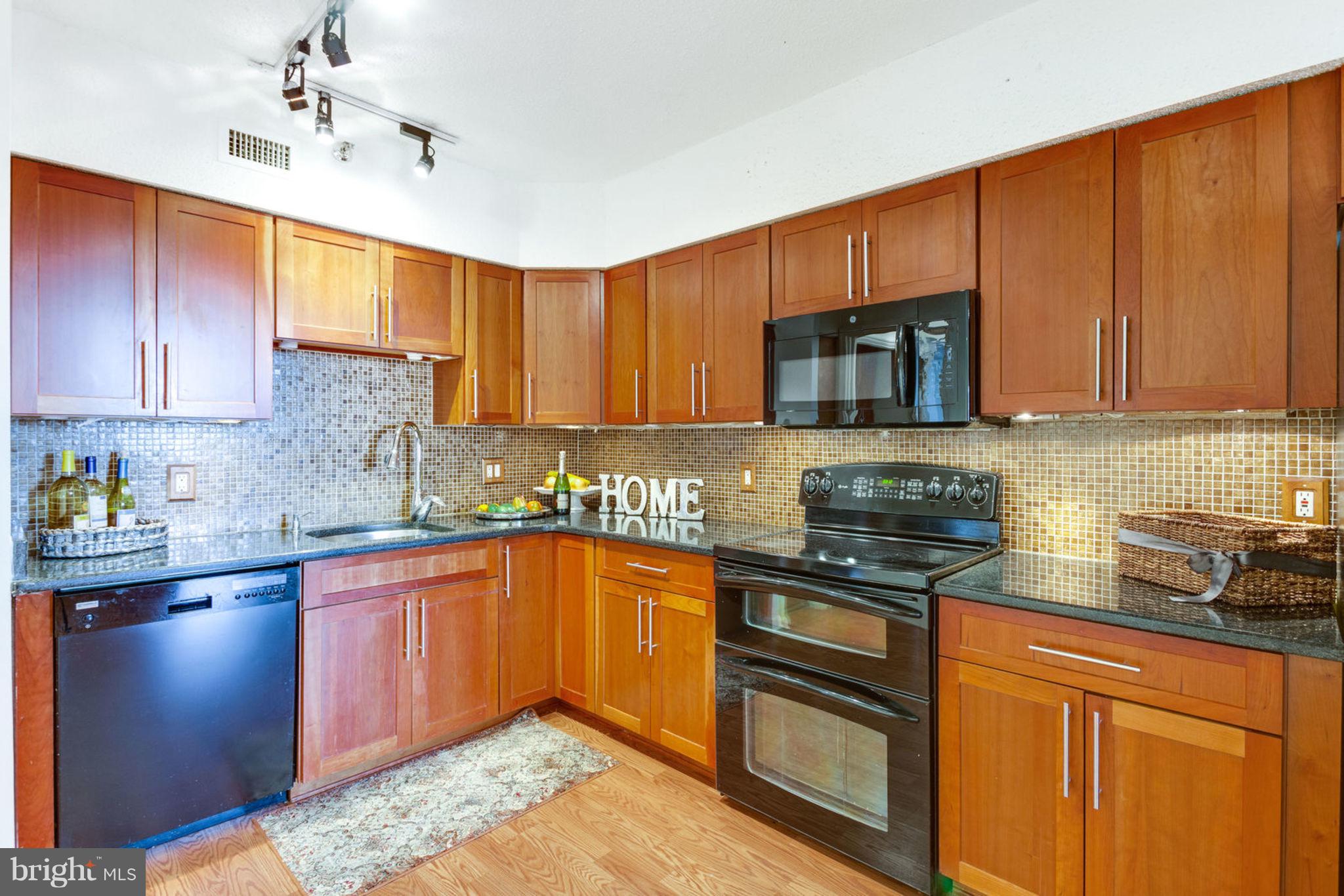 5501 Seminary Road, Unit 912S Falls Church, VA 22041 - Photo 3 of 53 Wood Kitchen Cabinets w/ matching backsplash