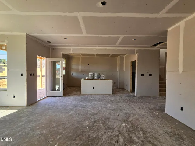 a view of a room with an entryway and cabinet