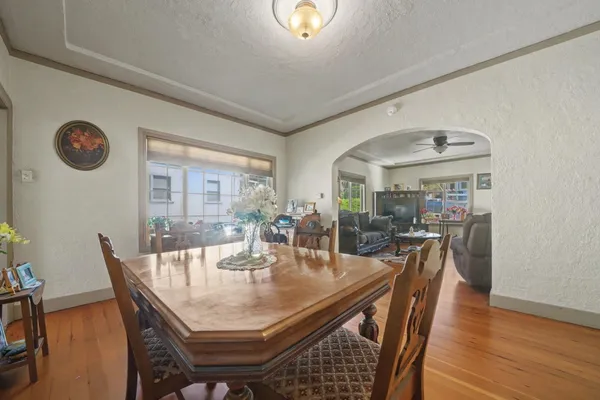 a dining room with furniture and window