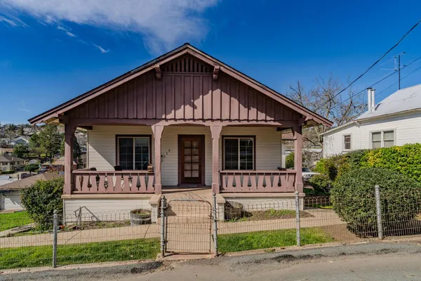 a front view of a house with a porch
