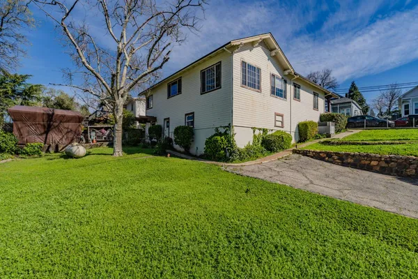 a front view of a house with garden