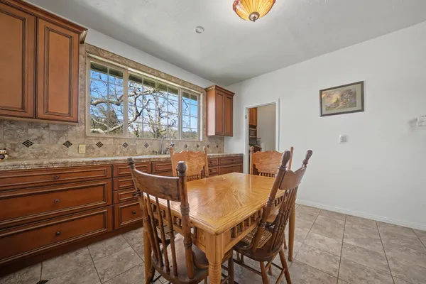 a view of a dining room with furniture and window