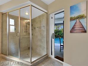 1902 Princess Court Naples, FL 34110 - Photo 18 of 26 Primary bath door to pool
