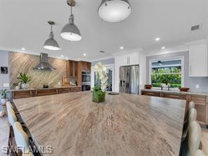 1902 Princess Court Naples, FL 34110 - Photo 2 of 26 A counter for serious entertaining and family dining