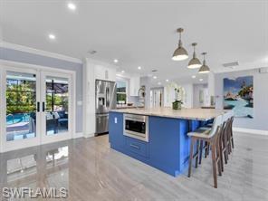 1902 Princess Court Naples, FL 34110 - Photo 5 of 26 Fun colors and French doors to pool area