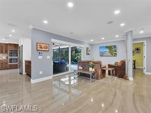 1902 Princess Court Naples, FL 34110 - Photo 9 of 26 TV room with sliders to screened patio