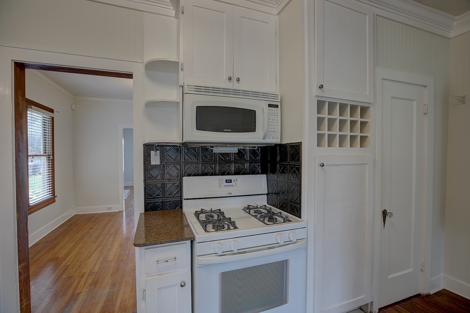 1708 Olive Street Georgetown, TX 78626 - Photo 11 of 40 a kitchen with a stove and a microwave