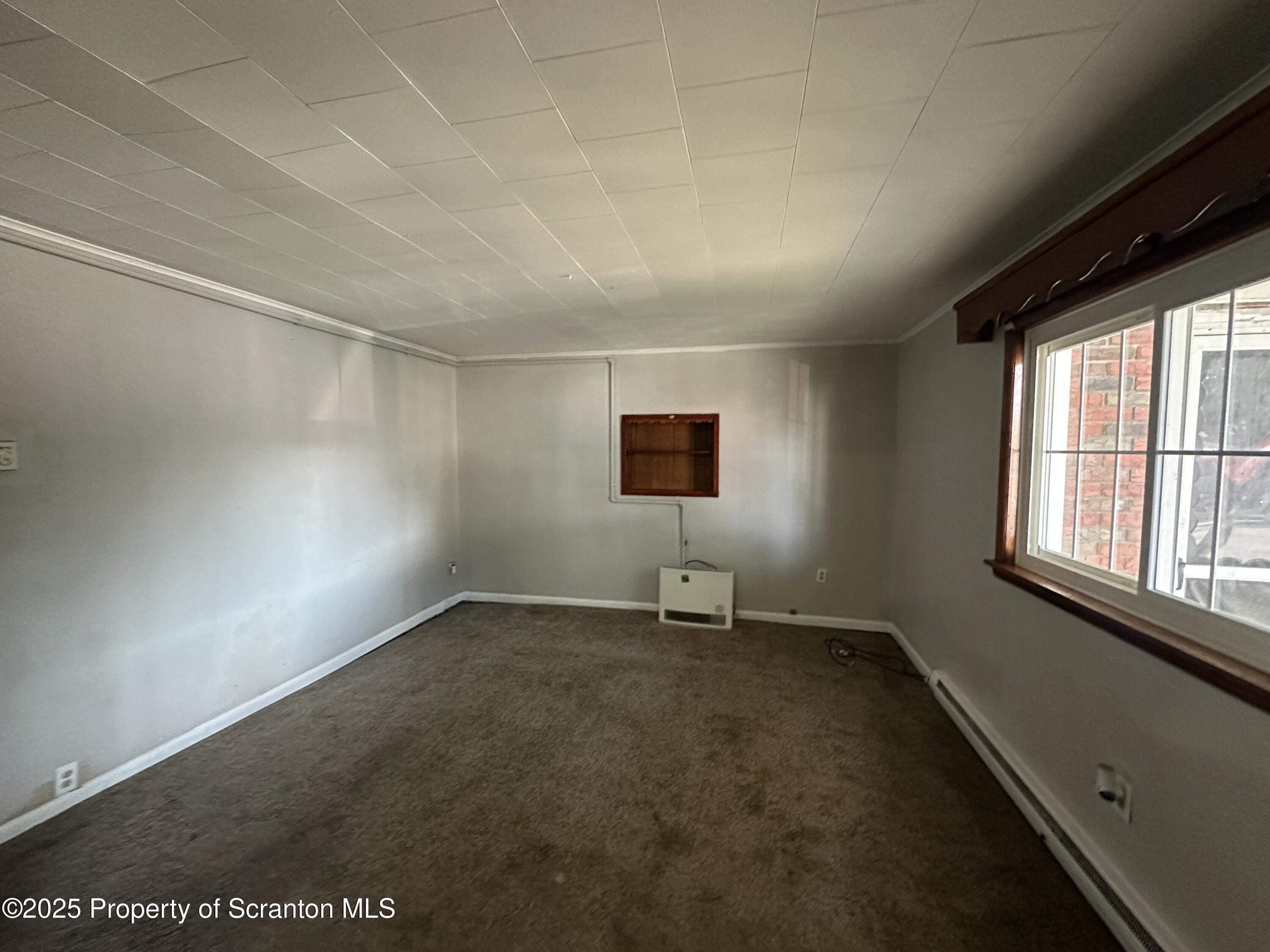 717 Prospect Avenue Scranton, PA 18505 - Photo 4 of 5 an empty room with windows