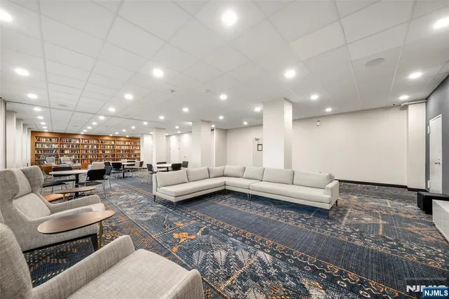 a view of a tennis ground with houses