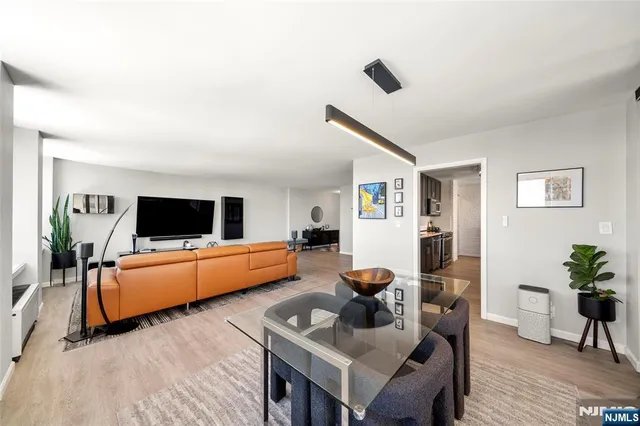 a kitchen with stainless steel appliances granite countertop a refrigerator a sink a stove and oven