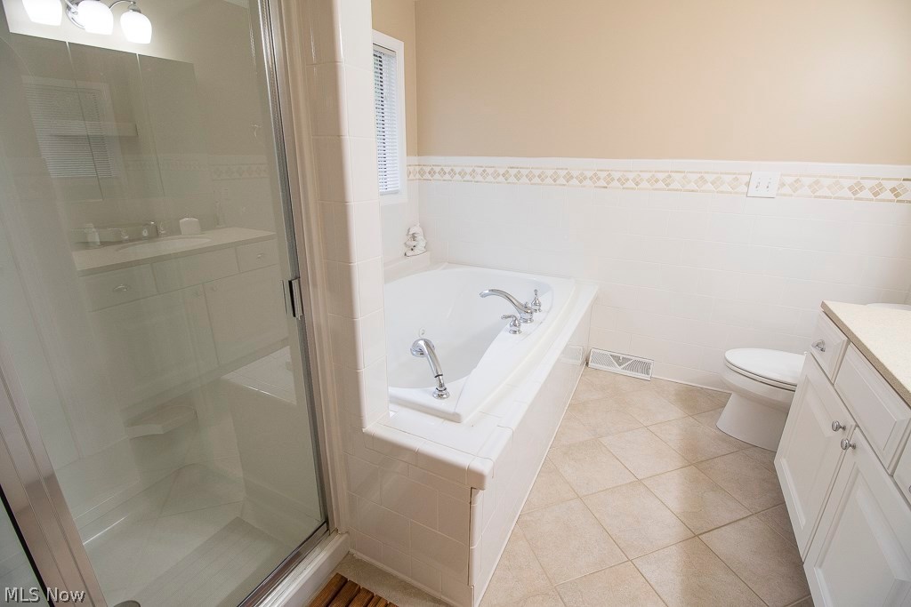 8737 Hendricks Road Mentor, OH 44060 - Photo 17 of 33 Beautiful bath off master bedroom with heated jacuzzi tub and heated floors as well as large shower